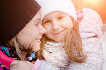 Family love concept: Portrait of a beautiful mother and little daughter six years old