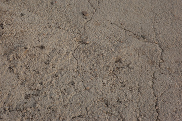 Textured concrete wall  with cracks as an abstract background