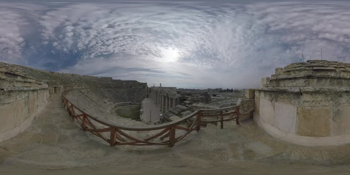 360 VR video. Inside view of huge ancient amphitheatre overlooking the ruins of Hierapolis city in Pamukkale, Turkey. Popular historic landmark. UNESCO World Heritage Site