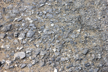 best texture of grey rocky road surface with small pebbles closeup