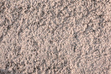 Pink background of textured concrete