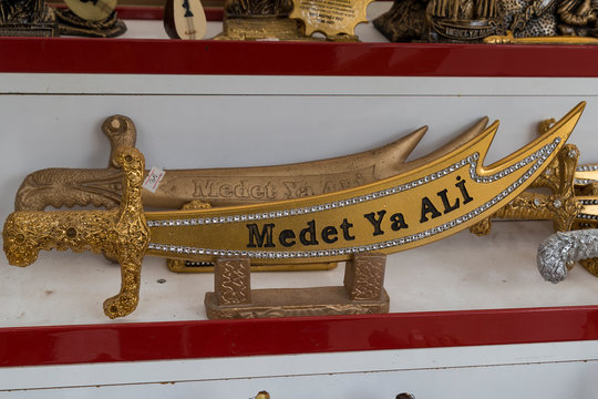 the legendary double edged sword of Imam Ali, It is a holy object among Shias and Alawites. Its Arabic name is Zulfiqar.