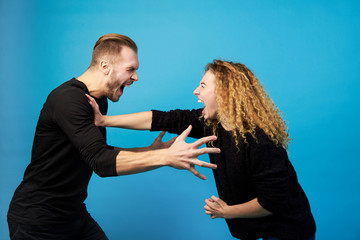 Man and woman screaming at each other, quarreling and fighting.