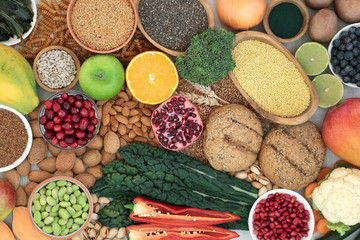 Health food for a high fibre diet with fruit, vegetables, whole grain bread rolls, grains, whole wheat pasta, nuts, seeds and spirulina powder. High in antioxidants, anthocyanins & vitamins.