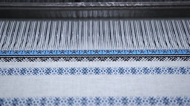 Creation of Ukrainian ornament on a loom.