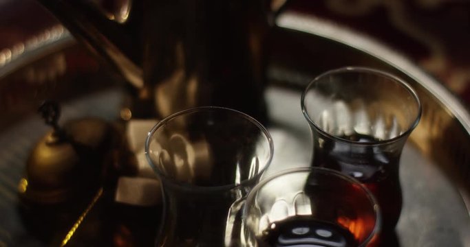 Arabic tea set steaming and vibrating by a sudden impulse