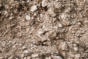 Light brown abstract background of rocky soil