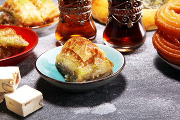 Middle eastern or arabic dishes and assorted meze, concrete rustic background. sambusak. Turkish...
