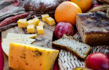 Autumn picnic: Cheese, bread, fruits. 
