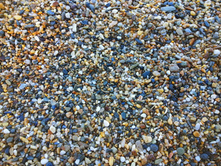 Colorful pebbles on beach texture