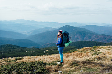 Naklejka premium Getting rid of all the problems during a hiking trip to the mountains.