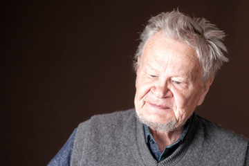 old senior man portrait on dark background b