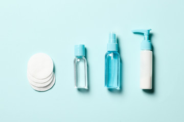  Composition with disinfectant and cream on a blue background. Place for text. Top view.