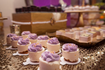 Banquet table with different food snacks, appetizers and dessetrs on corporate christmas birthday party event or wedding celebration