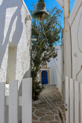 alley with a bell on the cycladic island of Paros, Greece