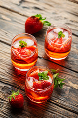 Fresh summer cocktail with ice, strawberry and mint
