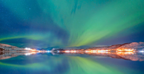 Fototapeta na wymiar Northern lights in the sky over Tromso, Norway