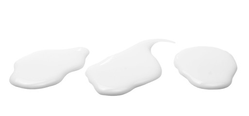 Spilled milk puddle isolated on white background and texture