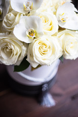 Gift box with roses and orchids