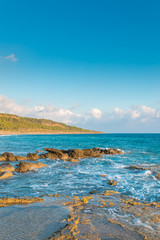 Fototapeta na wymiar Sea, rocks, waves and blue sky