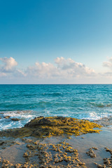Sea, rocks, waves and blue sky