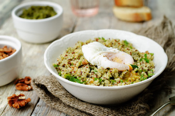 Basil nuts pesto quinoa with walnuts, parsley and poached egg