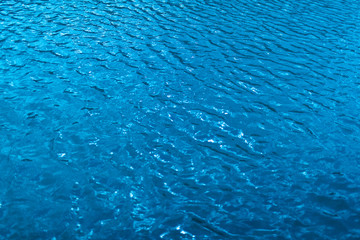 blue water in swimming pool background