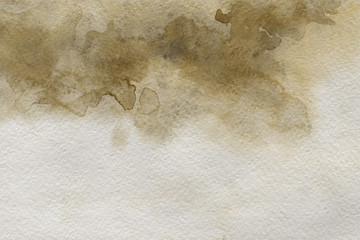Yellow watercolor texture with abstract washes and brush strokes on the white paper background.