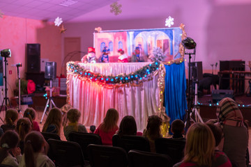 Children's puppet theater. Spectators, children's holiday. dolls. blurry