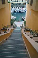 Sightseeing Malta. Descent with unusually long stairs to the marina in the St. Julian's.