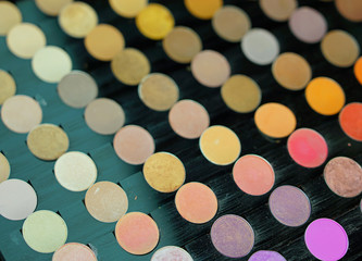 Obraz na płótnie Canvas Colorful display palette of round make-up 