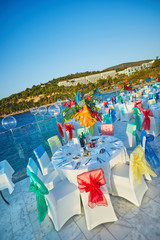 Festive served sea view terrace restaurant for corporate banquet or wedding