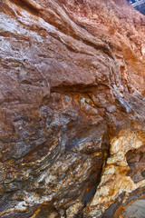 Stone texture at the foot of the cliff.
