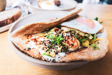Delicious vegan street food on a plate in outdoor setting. Unstaged photography