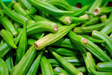 View of fresh green okra vegetable in bulk at a farmers market 