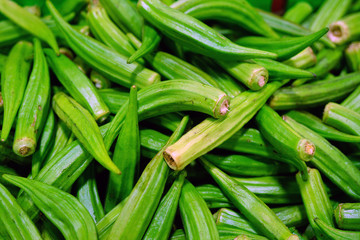 View of fresh green okra vegetable in bulk at a farmers market 