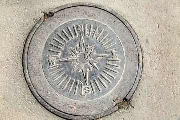 Cast iron manhole in asphalt