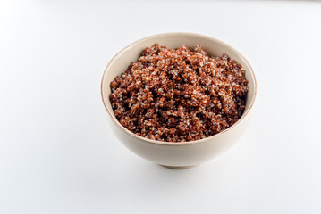Cooked prep red quinoa in a bowl.