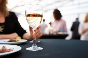 a glass of white and plates of food on a tray