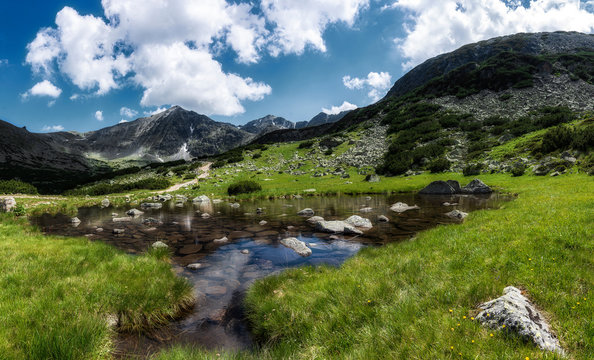 Panoramic view on mountain lake in front of mountain highest peak - Musala, Rila national park in Bulgaria