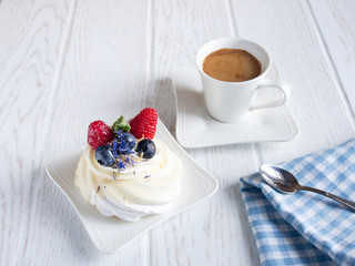 Sweet fruit cake with coffee cup on the table.