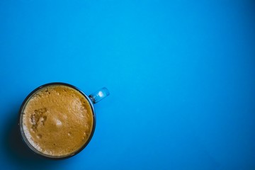 cup of coffee with blue background