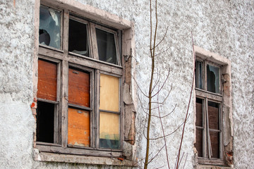 Fototapeta na wymiar broken glass in the window of an abandoned house