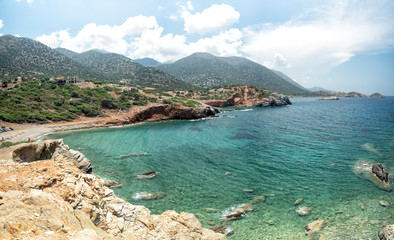 Fototapeta na wymiar Turquoise and green sea, view from the cliff of Vrahi Beach and Beach Good Land between Heraklion and Rethimno, Crete Island, Greece