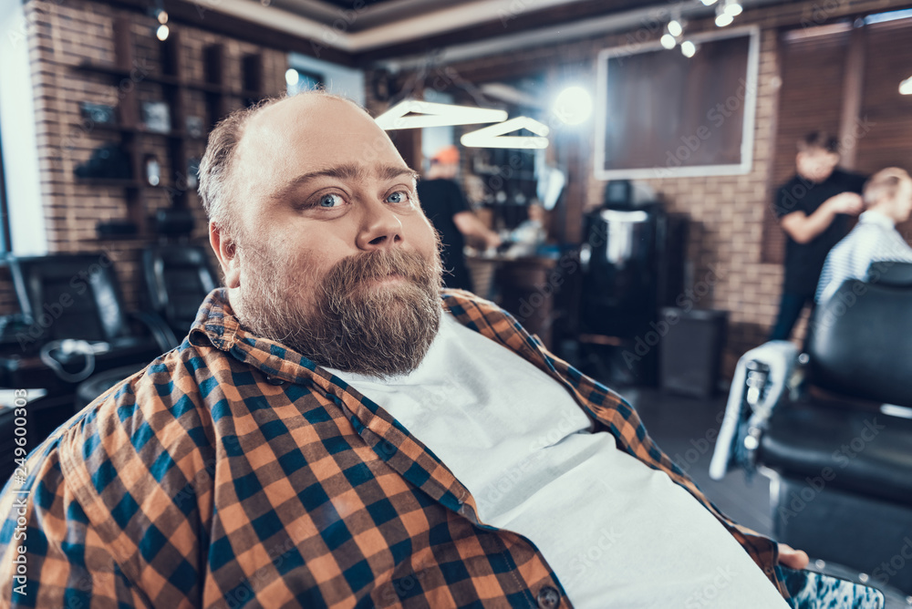 Poster portrait of attractive man in barber shop