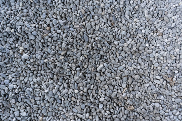 Top view on washed gravel in blue gray, size 10-12 mm, laid out on the ground