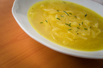 French onion soup on a white plate. Healthy food. Selective focus