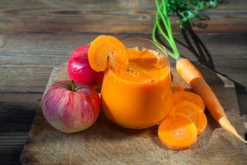 Carrot juice in glass on  table