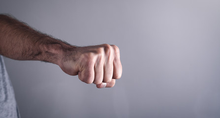 Obraz premium Caucasian angry and aggressive man threatening with fist.