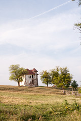 Fototapeta premium Old, abandoned, ruined house in the field